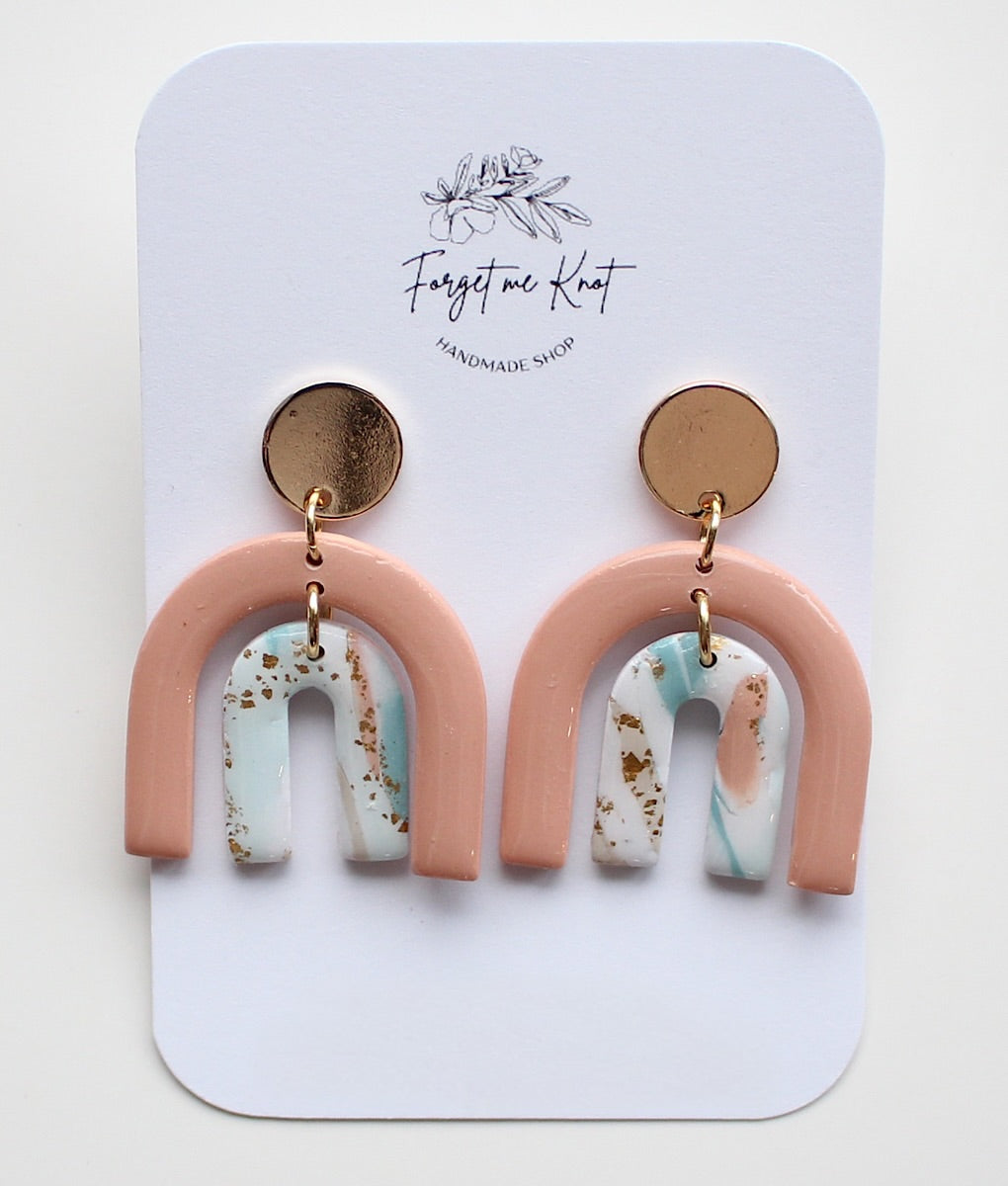 Boucles d’oreilles double arches roses glacés